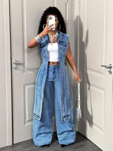 Trendy long denim vest with a white crop top and wide-leg jeans for casual streetwear.