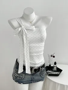 White polka dot one shoulder bow top with denim skirt detail, sweet and trendy style.
