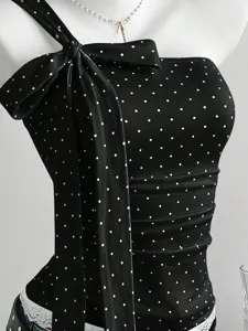 Black one-shoulder polka dot top with large bow detail, sweet and cute style apparel.