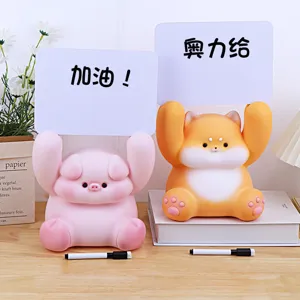 Cute animal message board piggy bank detail showing pig and shiba inu figures with whiteboards.