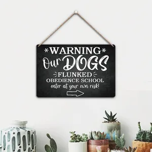 Detail view of American wooden humorous warning hanging sign with funny dog text and rope.