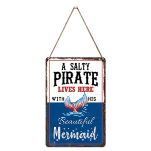 Nautical wooden hanging sign with inspirational pirate and mermaid quote for home decor.