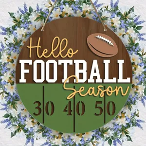 Detailed view of wooden football door sign with floral wreath, perfect for sports party decor.