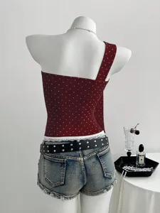 Trendy women sweet polka dot one shoulder camisole top with lace trim and denim shorts.