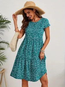Charming green floral print short sleeve crewneck tiered dress, perfect for summer casual wear.