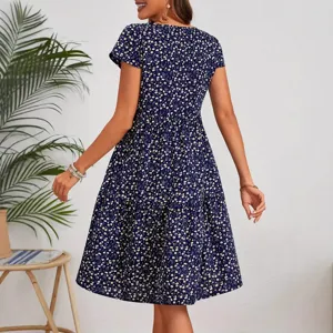 Detailed back view showing the floral print and tiered design of the dark blue short sleeve dress.