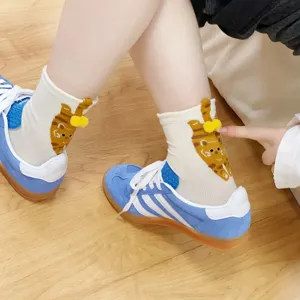 Cute 3D cat mid-calf socks for women featuring fun yellow pom-pom accents and soft cotton fabric.