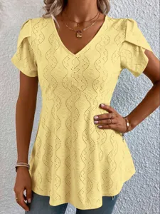 Close-up view of the yellow V-neck short sleeve top showcasing detailed eyelet embroidery.