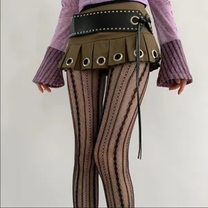Sexy black fishnet pantyhose with vertical stripes, stylish gothic streetwear tights for women.