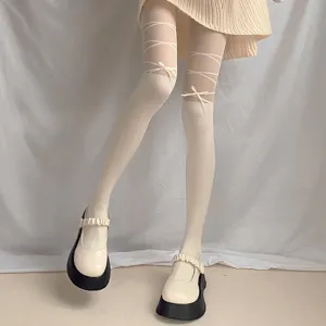 Women white pantyhose with ribbon bows, thin sweet style tights, anti-snagging detail shot.