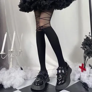 Black Gothic lace-up tights and platform shoes set, perfect for stylish alternative looks.