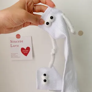 Cute white crew socks with 3d eyes and magnetic holding hands design, sweet casual knit hosiery.