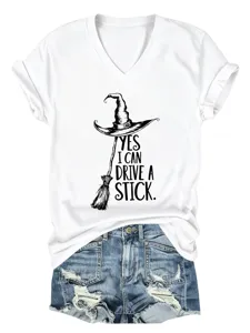 Casual white V-shirt with short rolled sleeves and funny witch hat print paired with denim shorts.