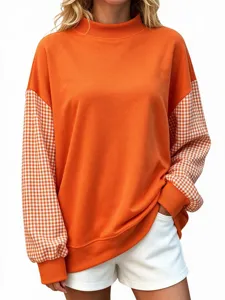 Women orange long sleeve sweatshirt with gingham plaid spliced sleeves and high neck.