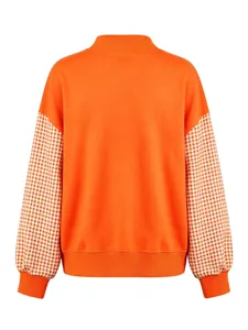 Orange women's long sleeve sweatshirt with mock neck and stylish plaid spliced sleeves.