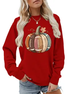 Detailed view of the women's red long sleeve sweatshirt featuring a creative football pumpkin graphic.