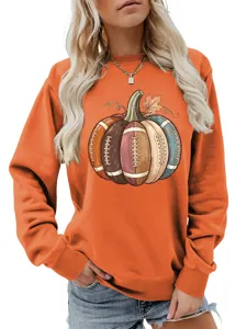 Detailed view of the autumn pumpkin football graphic print on this orange casual sweatshirt.