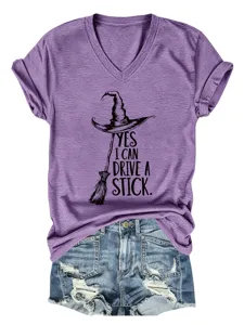 Detail view of purple V-neck short sleeve t-shirt with funny witch hat graphic and rolled cuffs.