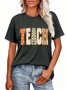 Close-up detail of the women's dark grey short sleeve t-shirt featuring retro teach letter print.