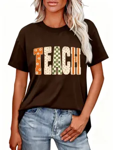 Close-up detail of the brown graphic t-shirt featuring stylish TEACH letter print.