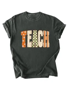 Detailed view of women's short sleeve teacher graphic tee with vintage floral letter print.