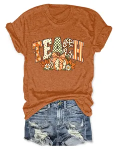 Gedetailleerd overzicht van het herfst pompoen grafische korte mouw t-shirt.