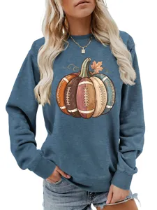 Detailed view of the autumn pumpkin football graphic print on a stylish blue casual sweatshirt.