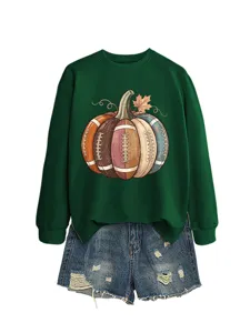Dark green crewneck sweatshirt with a creative football pumpkin graphic and denim shorts.