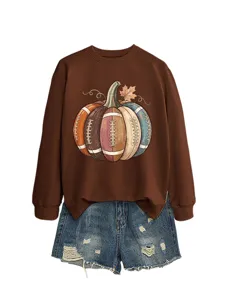 Detailed view of the brown sweatshirt featuring creative football pumpkin graphic and denim shorts.