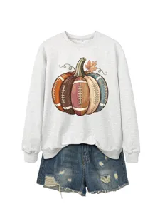 Close-up detail of the vintage football pumpkin graphic printed on a light grey crewneck sweatshirt.