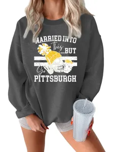 Detail view of dark grey women's graphic crewneck sweatshirt featuring skull print.