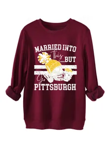 Women's fleece crewneck sweatshirt detailed view, burgundy thermal pullover with graphic print.