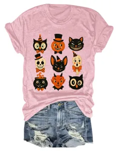 Vintage Halloween graphic pink t-shirt paired with distressed blue denim shorts for women.