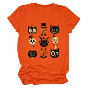 Close-up detail of retro Halloween graphic print on orange short-sleeve crewneck t-shirt.