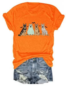 Close up detail view of Halloween German Shepherd graphic print on orange short sleeve tee.