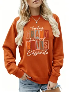 Détail de sweat-shirt orange femme automne, joli haut graphique à manches longues tendance.