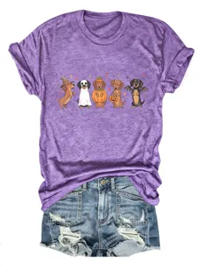 Dettaglio t-shirt grafica bassotto Halloween e shorts in denim con stampa cane e tessuto jeans.