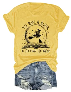 Detailed view of casual yellow short sleeve t-shirt with book and witch graphic print.