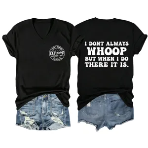 Close up details of black v-neck t-shirt featuring front chest and back white slogan print.