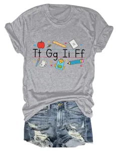 Casual women's short sleeve t-shirt featuring fun letter graphics and school theme elements.