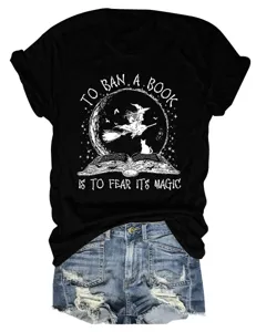 Close-up detail of the black short sleeve t-shirt featuring a witch and book graphic print.
