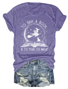 Women purple short sleeve t-shirt casual graphic tee featuring cute witch book print.