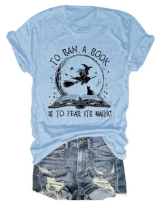 Women short sleeve graphic t shirt with witch book design paired with denim shorts.