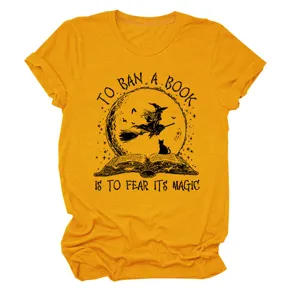 Close-up detail of the mustard yellow witch book graphic short sleeve crewneck t-shirt.