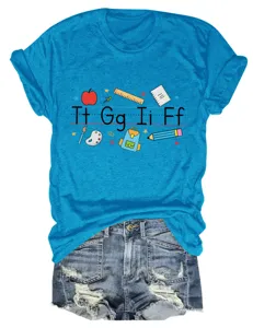 Casual blue teacher t-shirt with cute school supply graphic print paired with denim shorts.