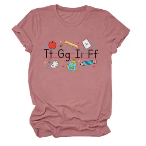 Detail view of the teacher themed alphabet print on a casual pink women short-shirt.