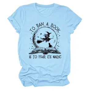 Light blue short sleeve crewneck graphic t-shirt detail showing witch and book print
