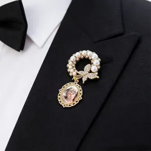 Elegant pearl rhinestone butterfly brooch with photo frame pendant for custom memory.