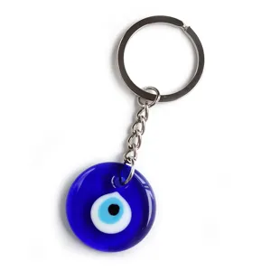 Close-up detail of the traditional blue glass evil eye keychain pendant with metal ring hardware.