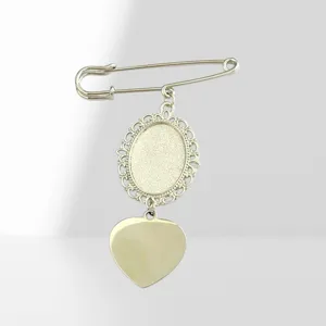 Close-up detail of the European vintage style lace oval brooch blank pin with heart charm.